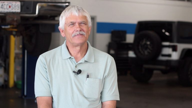 Marvin Gott smiling in his transmission shop in Springfield MO.